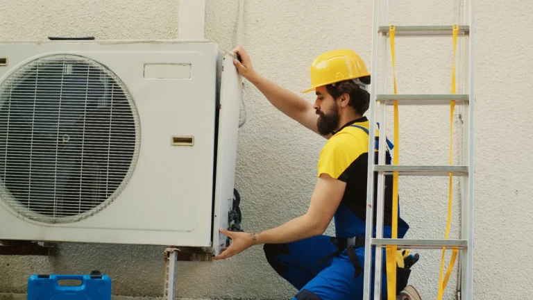 wireman-dissasembling-air-conditioner